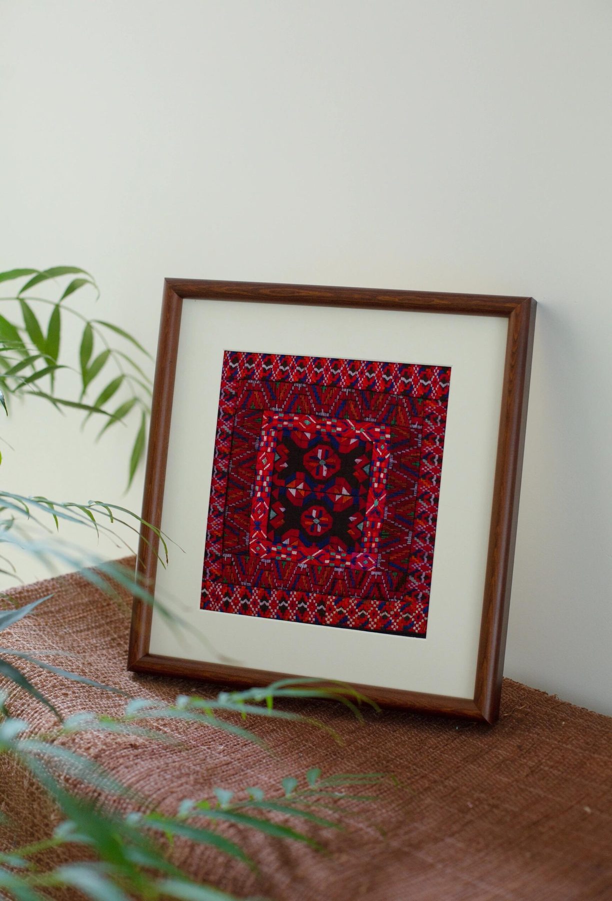 Framed crimson embroidery art
